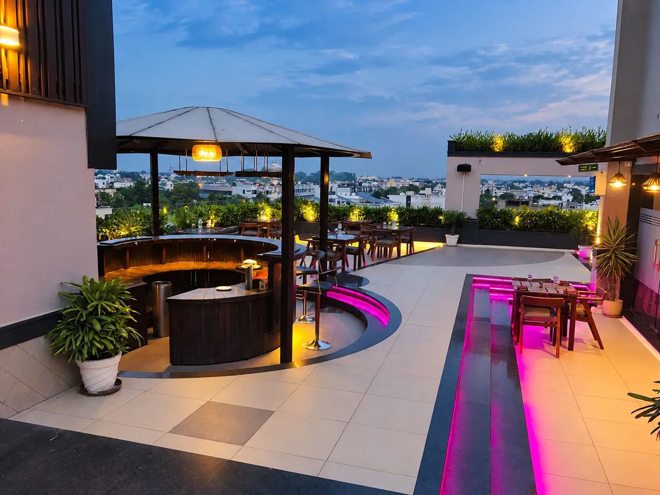 Rooftop at Dusk Rooftop dining terrace with a circular bar and city views at dusk