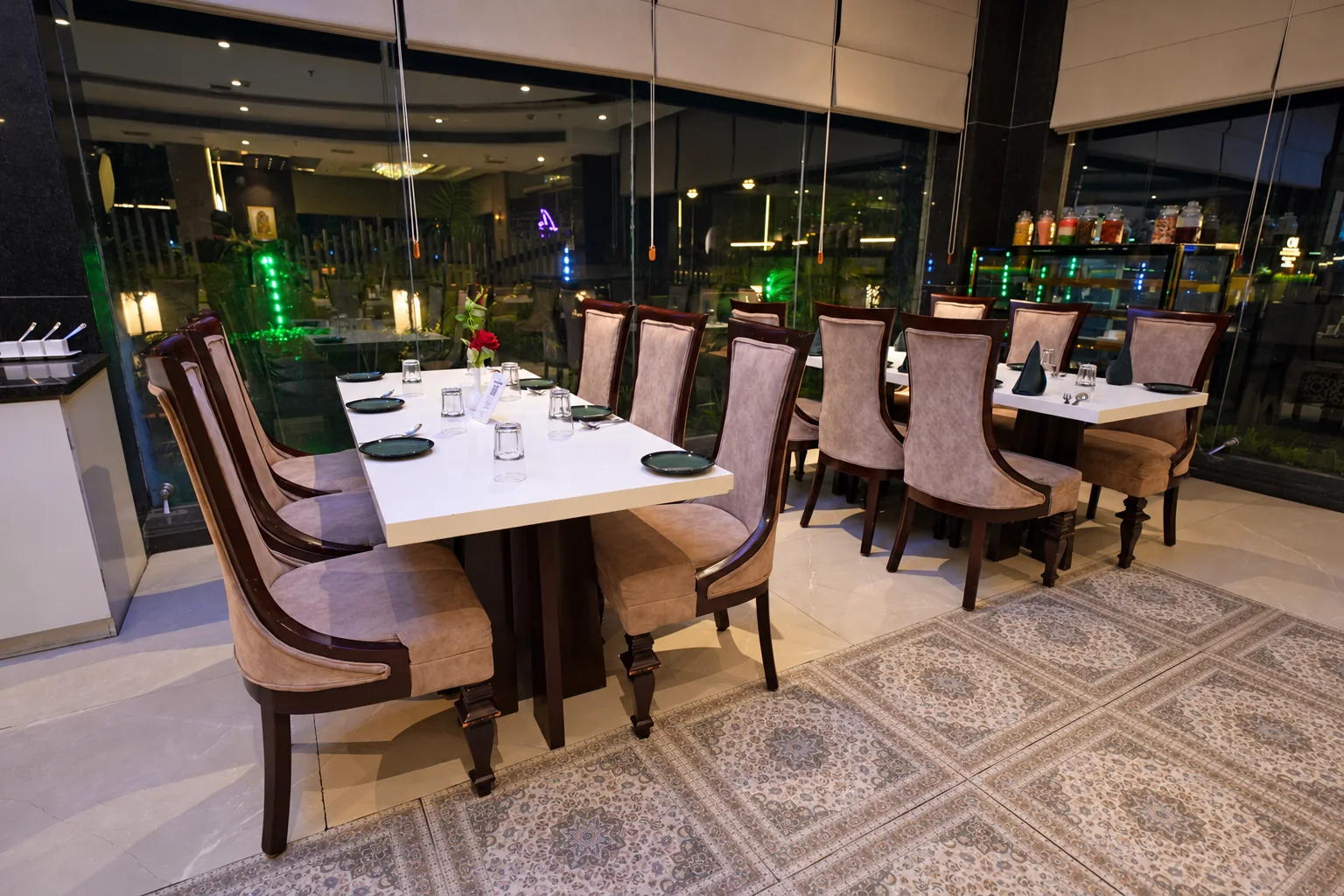 Dining tables beside the windows at Hotel Ranbirs restaurant